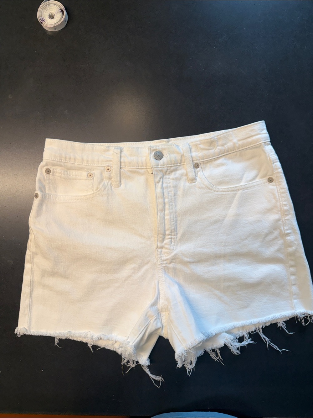 Madewell high-rise denim shorts. Size 29. Tile white.